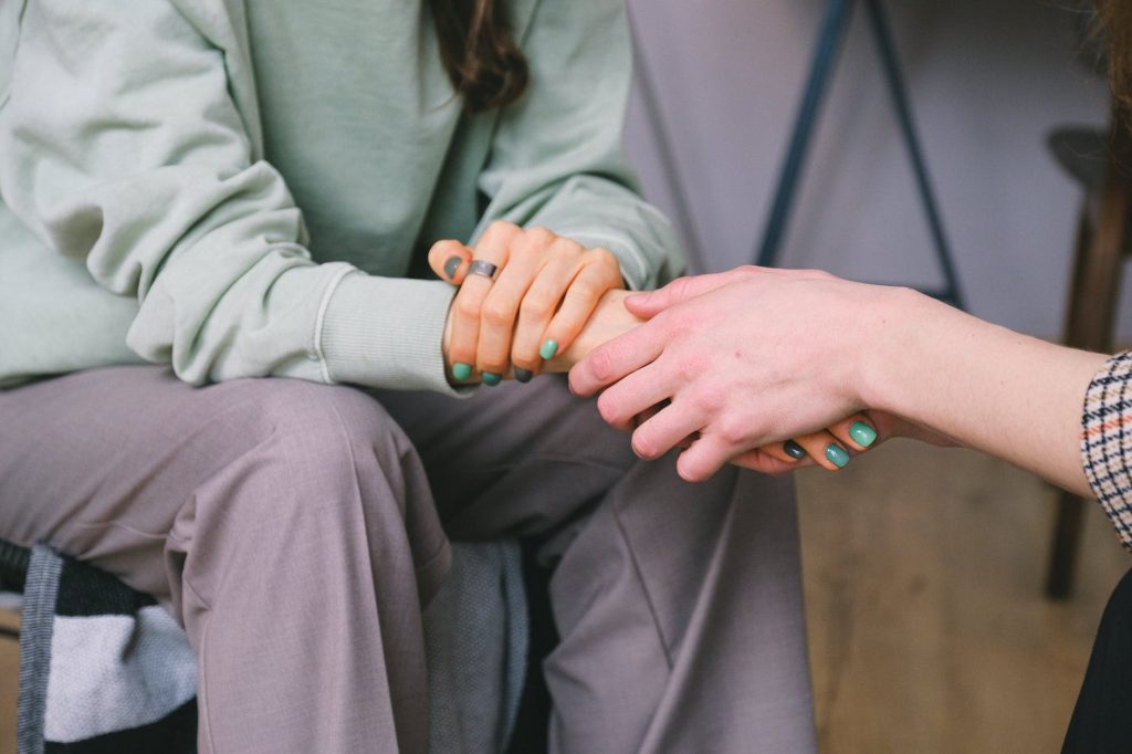 crop psychologist supporting patient during counseling indoors